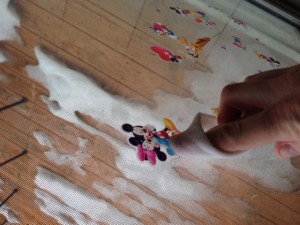 Rub on sticker or adhesive
